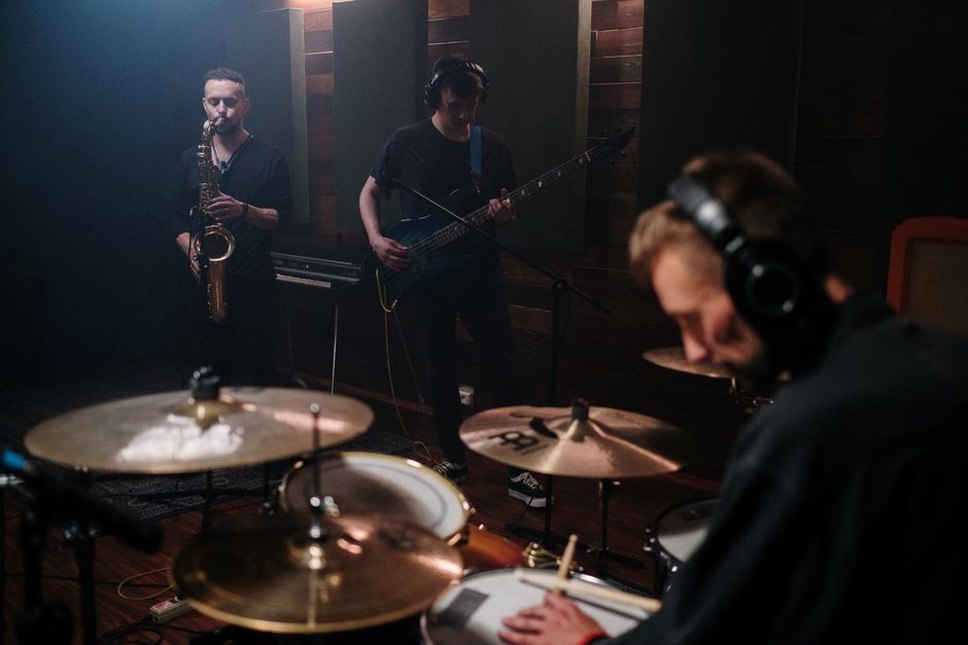 Finnish thrash band playing together in studio