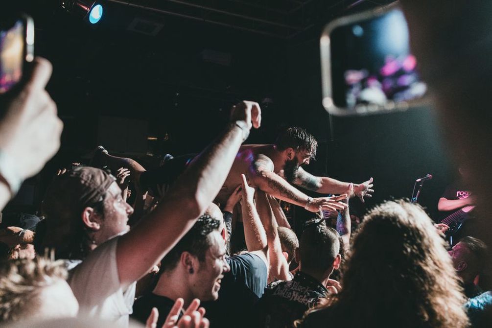Thrash metal fans in a mosh pit