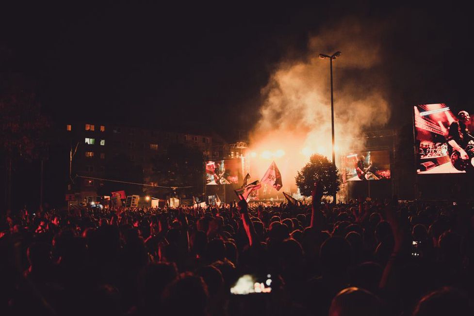 Thrash metal fans in a lively concert atmosphere
