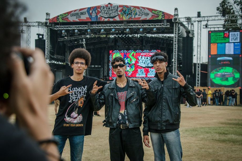 Thrash metal fans enjoying a live festival performance