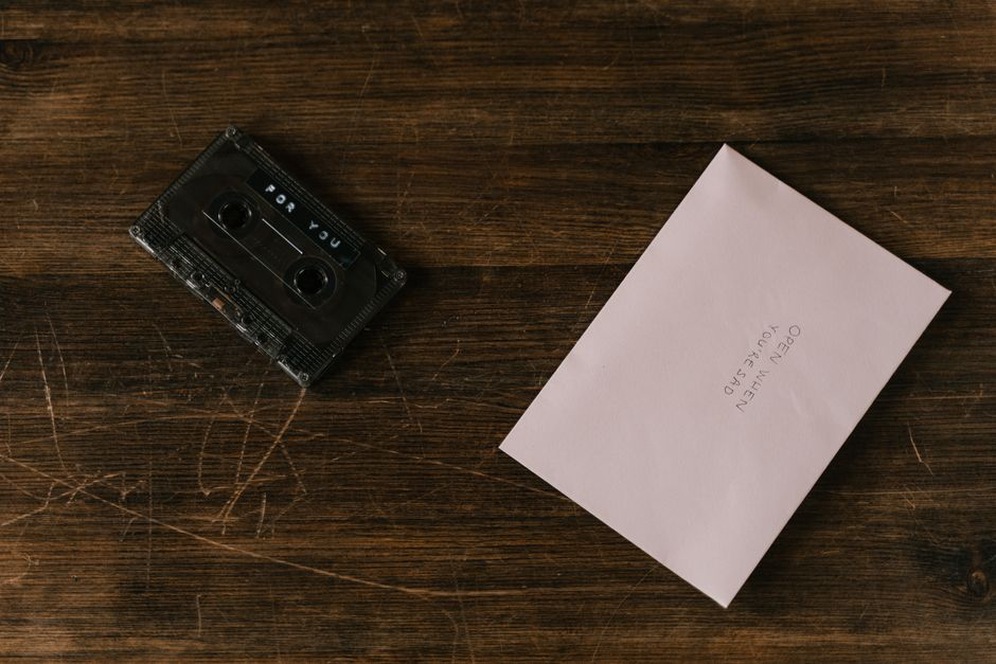 An addressed envelope beside a cassette insert