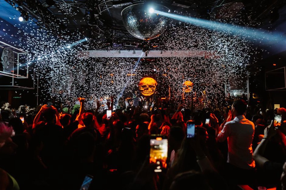 A close crowd at an intimate heavy-music gig
