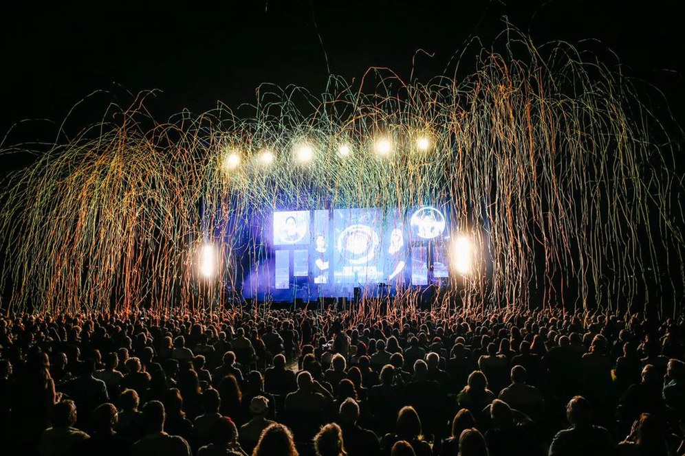 Festival audience facing an energetic heavy metal set