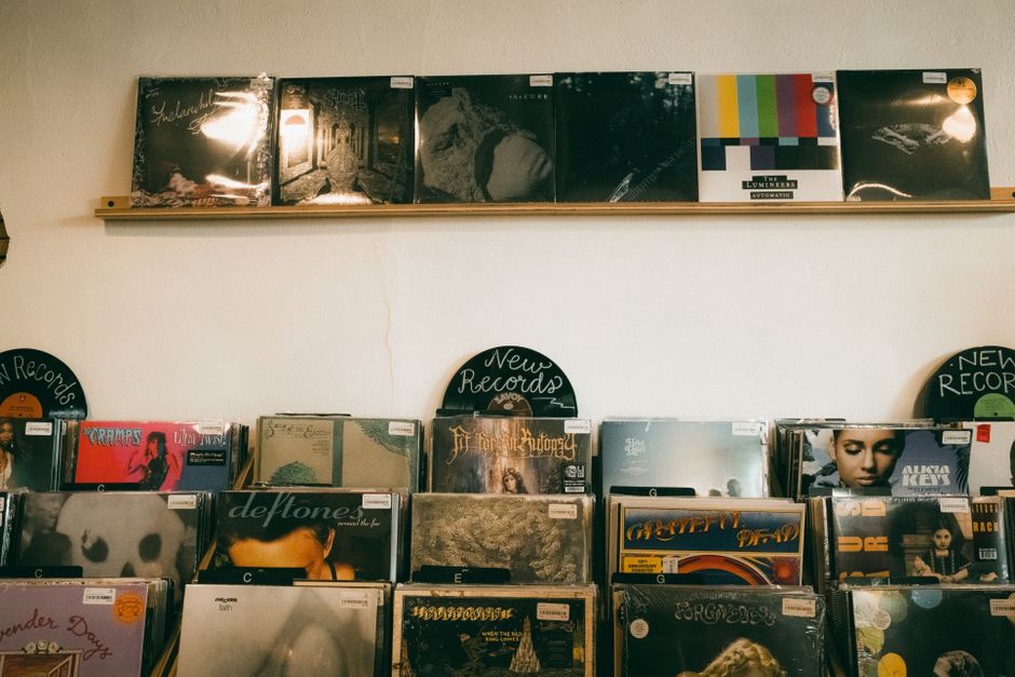 Album spines filed together on a shelf