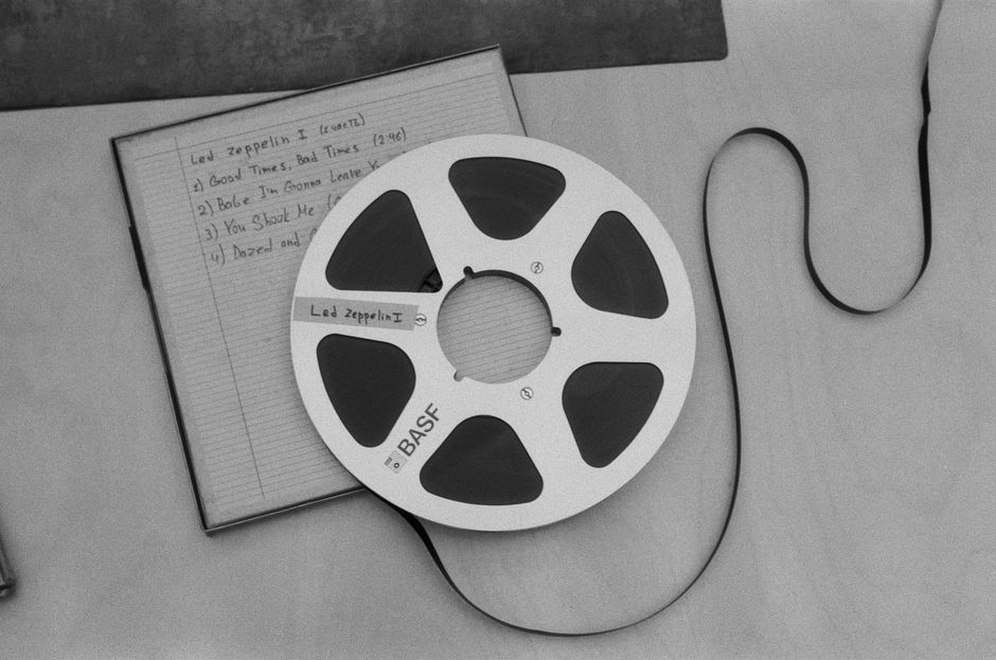 A cassette and handwritten track list on a table