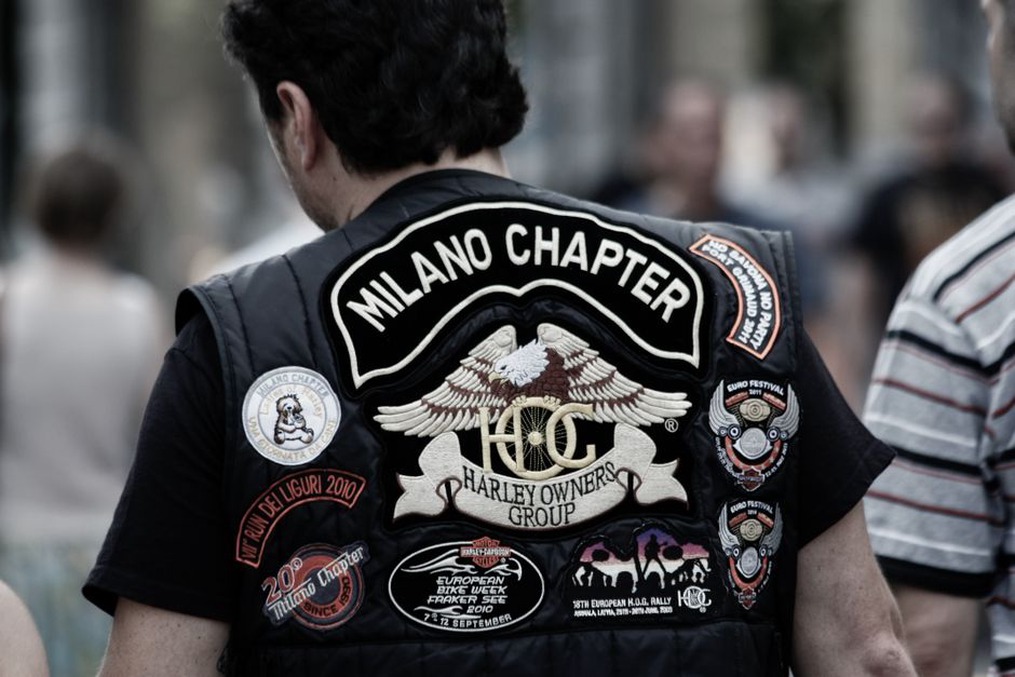 Band patches share space on a worn denim vest