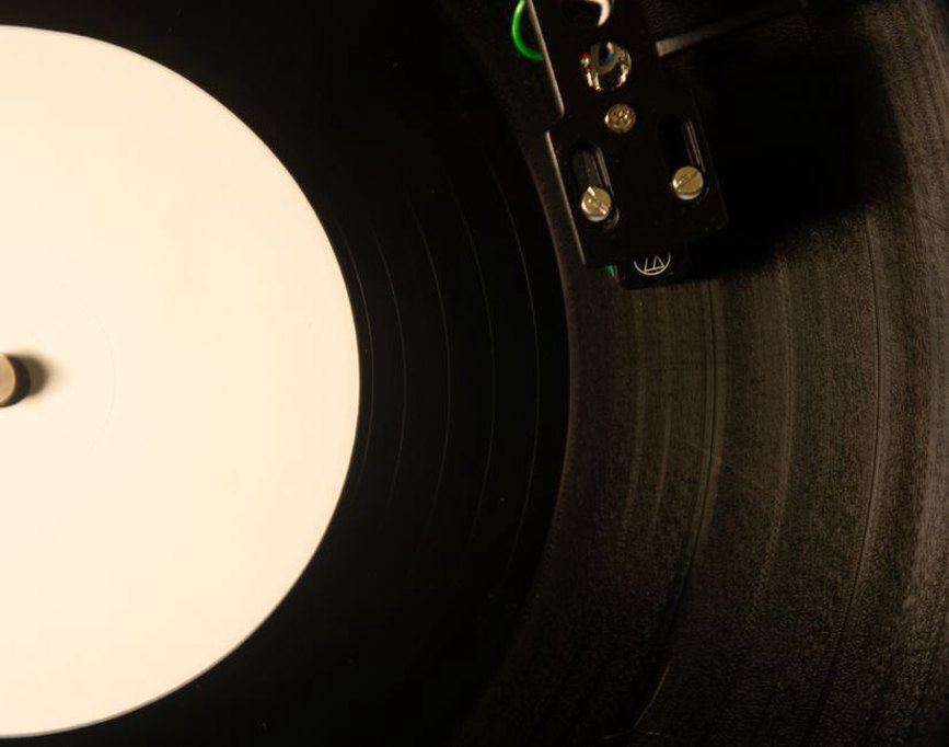 Printed lyrics beside a well-used record sleeve