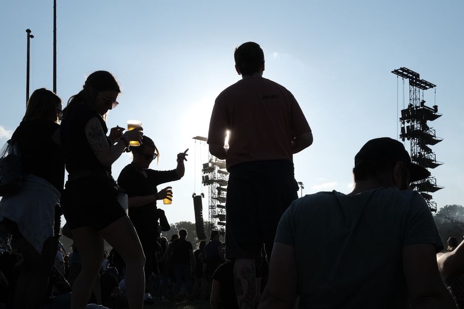 A fast metal set reaches a festival crowd