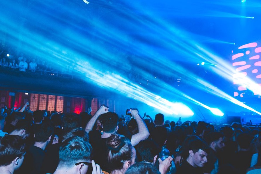 Audience gathered close to a small club stage