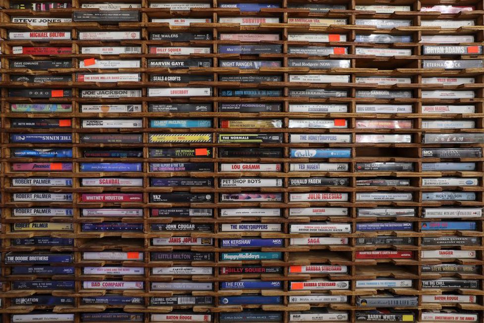 Stack of dubbed cassette tapes with handwritten labels from Finnish bands