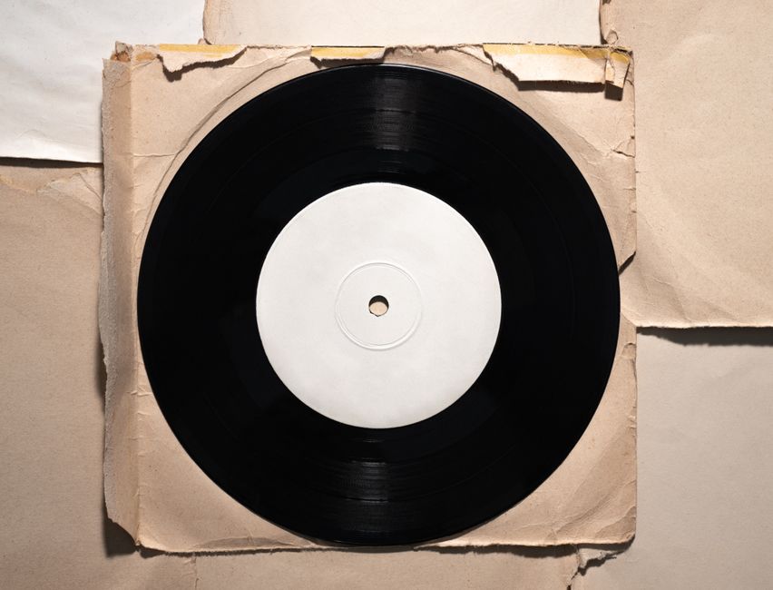 LP jacket beside a smaller CD booklet