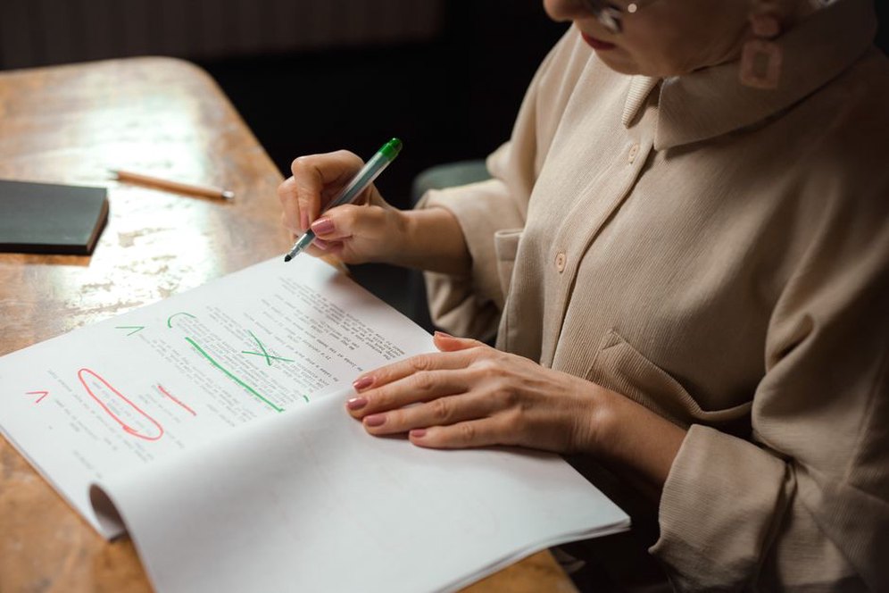 A reviewer checks a transcription against the original page