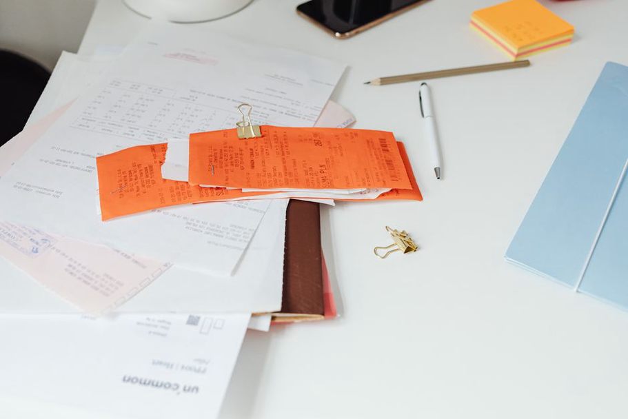 Receipts and dated notes kept together in a binder