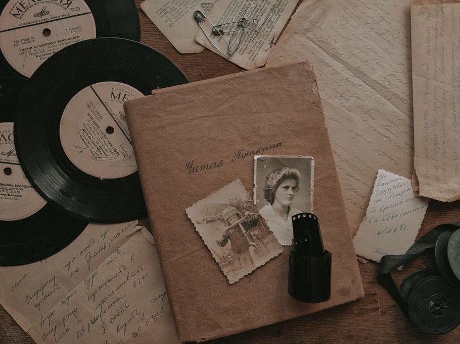 Release notes arranged beside physical recordings