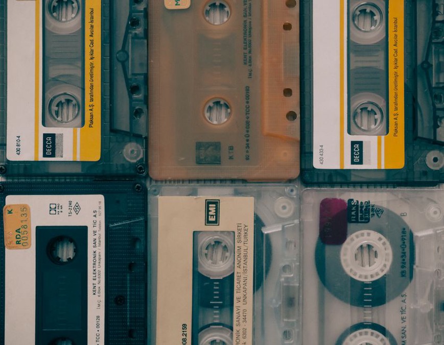 Cassette sleeves beside notes on release details