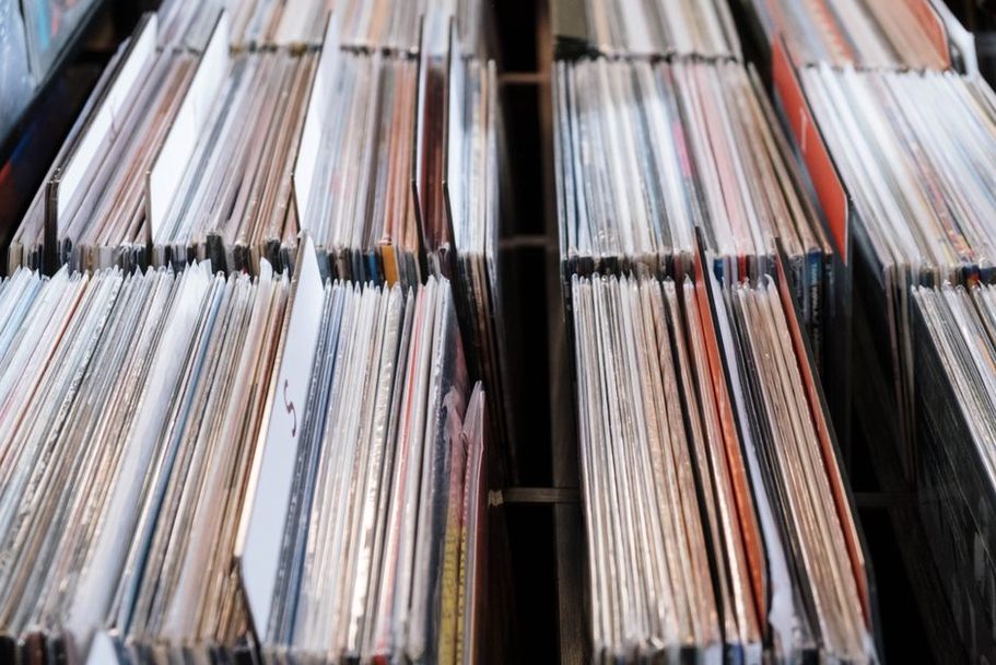 Record sleeves and credits laid out for comparison