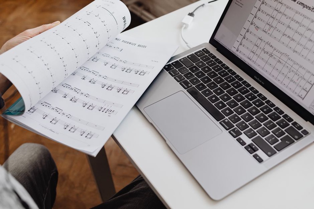 Release details reviewed beside a laptop