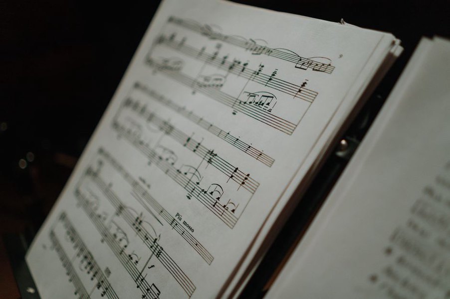 Printed concert ephemera beside a reporter's notebook