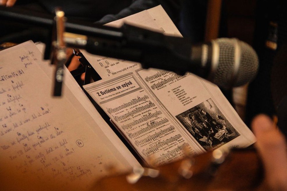 A flyer and notes under review at a desk
