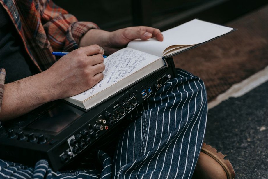 Handwritten research notes beside record sleeves