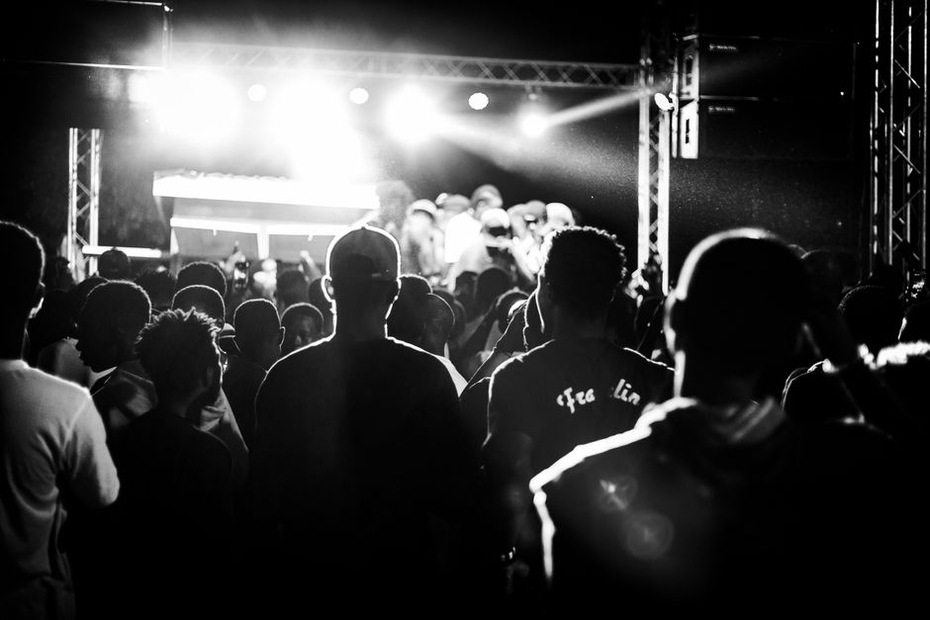 Audience gathered close to a small venue stage