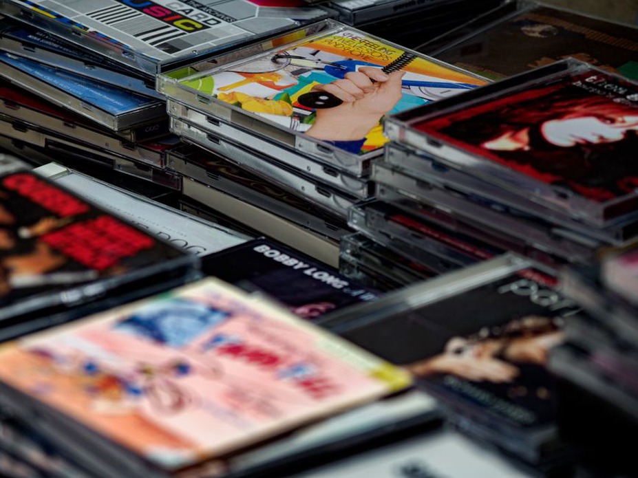 Open booklet beside a marked CD case