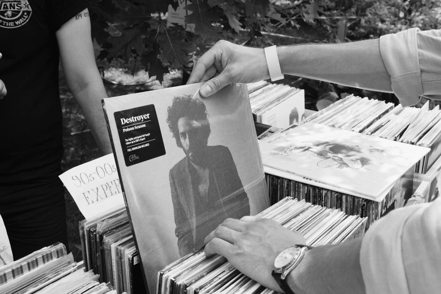 Festival ephemera beside a physical release